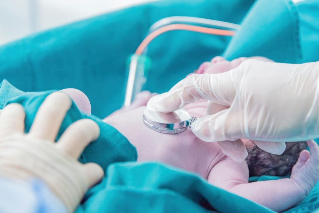 a doctor assessing a newborn child